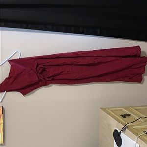 Red jumpsuit with cut out stomach and front bow